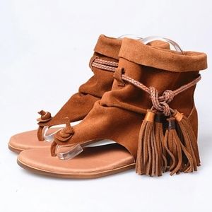 Gladiator flat sandal with fringe ties